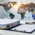 Climate briefing folders and a globe on a desk, photographed in soft light to suggest UN climate reporting and Earth’s changing climate.