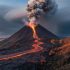 “A low-angle view of a smoking volcano with glowing lava at its base and ash drifting into the sky over a rocky landscape.”